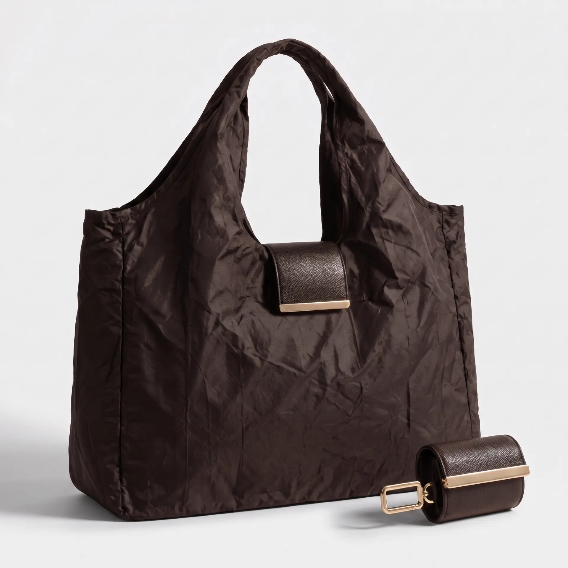 Espresso brown Cliqué Tote beside its folded pouch with gold hardware
